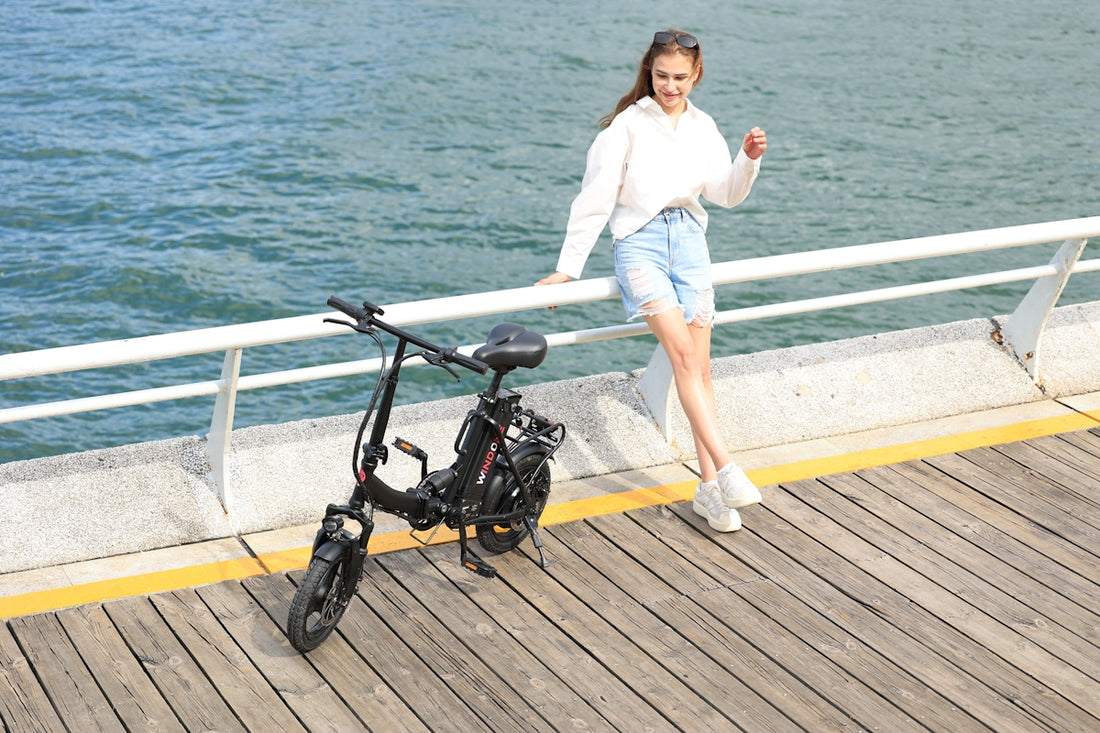 A woman standing next to a bike on a pier
