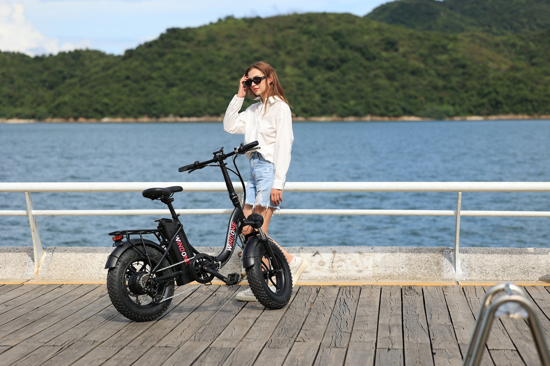 A woman standing next to a bike on a pier