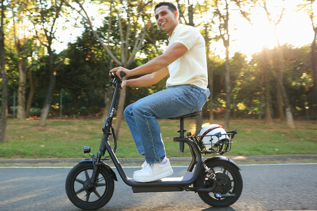 A man rides an electric scooter on a sunny day