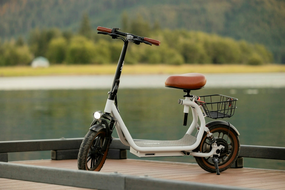 A white electric scooter sits on a dock